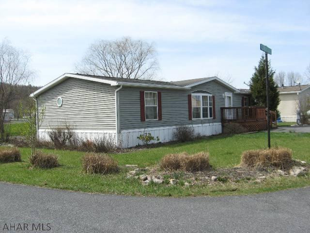 This spacious three bedroom, 2 bath home is located on a nice corner lot in the Country Club Mobile Home Park just minutes from Downtown Bedford.  The oversized rear deck with handicap access, front porch and shed are extras that go along with this home.