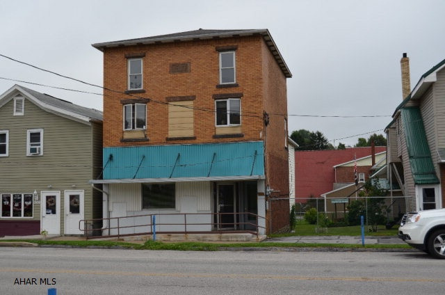 Great income property. 2 apartments that are currently tenant occupied. One has two bedrooms and the other has three bedrooms. All appliances are included except washer dryer in bottom apartment. Vacant office space available that is handicap accessible.