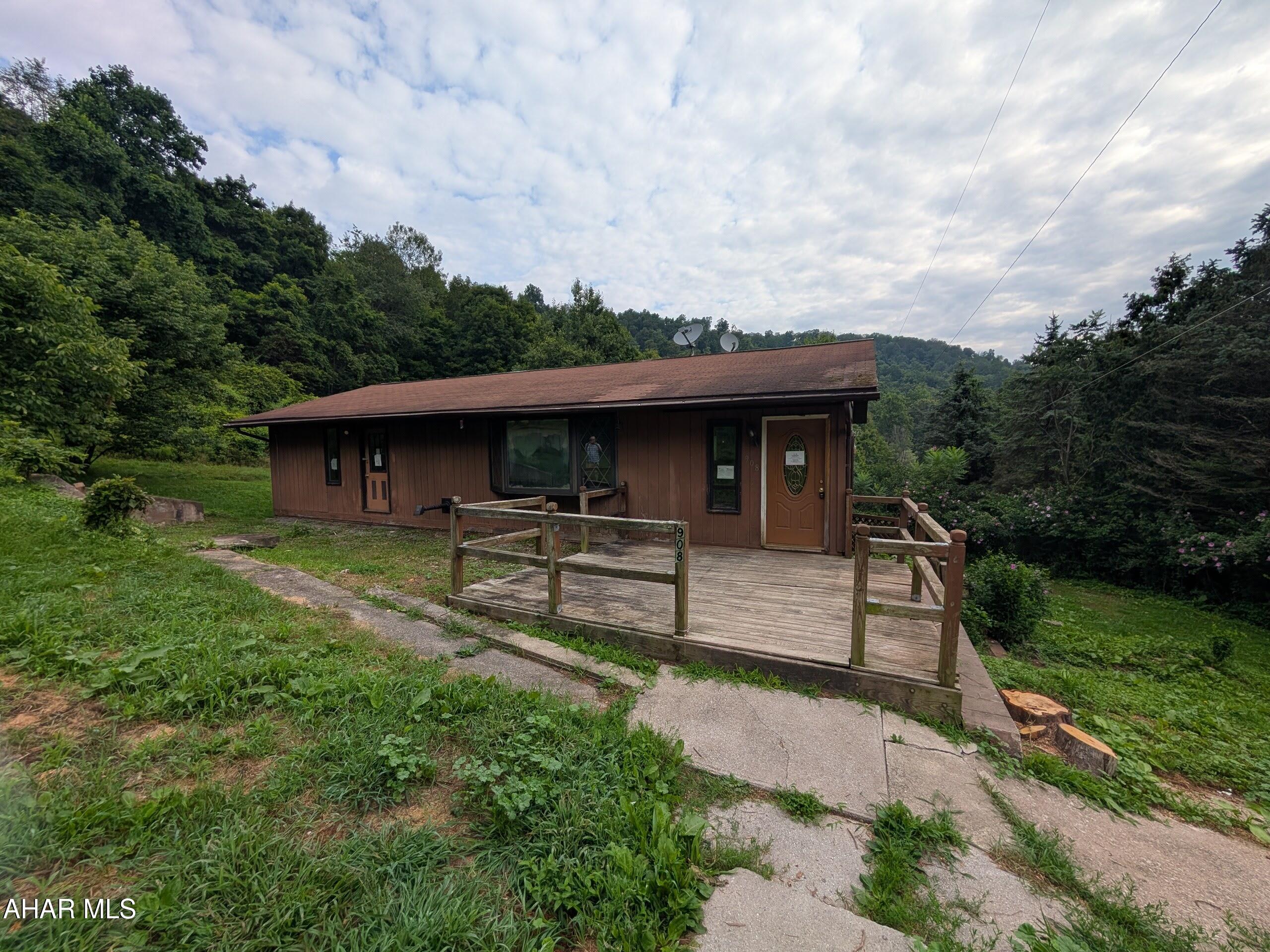 Rare find - secluded Tyrone area 1 story home on 10+ wooded acres! Features large living room (roughed in for wood burner) with adjoining kitchen and dining area for open concept living. First floor laundry room off kitchen and large entry foyer/mudroom. 3 bedrooms and 1 bath round out the first floor. Home needs some TLC throughout, but a real gem in the rough! Asset built prior to 1978 lead based paint potentially exists. May qualify for seller financing (Vendee). Buyer pays both transfer taxes.