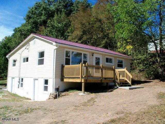 JUST finished interior and exterior professional remodel of this one floor living ranch home on 1.8 acres! Neutral throughout, living and family rooms PLUS a large eat-in kitchen with laundry area! Basement exits to ground level. 2009-2010 improvements include exterior insulation and vinyl siding, windows, subflooring in kitchen and bathroom before vinyl, carpeting, paint, green sand filter water system, front 16'x8' deck and back 8'x8' deck, bathtub-sink-faucets-cabinet-toilet-greenboard, kitchen has custom oak cabinetry-counters-sink-faucet, whole house painting, flooring, lighting. Metal roof from 2005. New yard. Private setting.