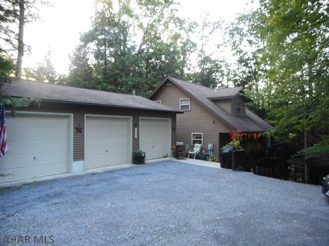 Well maintained 1.5 story home on an acre wooded lot and three car garage. Home has living room with cathedral ceiling, equipped kitchen, Dining area, large family room with decorative gas burner, bath and bedroom on 1st floor. Loft bedroom on second floor. Basement is finished with a bedroom, bath and family room. New floor coverings. Wrap around deck overlooking the woods. Great home for the money! Located in Glendale Yearound on a dead end street. New hot water heater December, 2017.