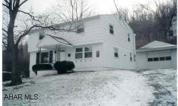 Cozy home, neutral carpeting, newer windows, corner fireplace, center-hall design. Sitting area (9x7) on second floor, pantry, updated bathrooms. Easy commute to town and recreation. Great starter home.