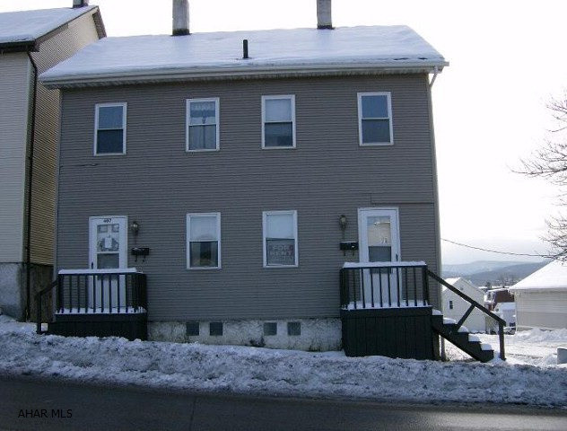 2 Unit Apt building- 2 BR each, vinyl sided. Was Sect 8 -All separate utilities. Must be sold with 407-409 17th St & 1704-05 4th Ave. W/ all land behind