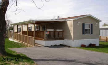 2004 Champion singlewide mobile, 2 BR, 2 BA, Oil F/A,  Central A/C, especially built with wider exterior and interior doors. Porch with ramp. All appliances and shed. Lot rent $180 includes garbage. 2004 Champion singlewide mobil, 2 BR, 2 BA, Oil F/A, Central A/C, especially built with wider exterior and interior doors. Nice porch with ramp. All appliances and shed. Lot rent $180 includes garbage.