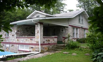 CHARMING STONE HOME WITH A BEAUTIFUL SETTING. MANY UPDATES. METICULOUSLY MAINTAINED.