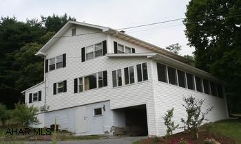 3BR/2 full bath 2-story house located on 2.48 acres conveniently located close to Bedford. 3BR/2 full bath 2-story house located on 2.48 acres conveniently located close to Bedford. Large master suite, Kitchen, DR, Den opens to LR, main level laundry room, utility room, central air. Pleasant enclosed porch; private cool, shady yard; patio; private drive, detached 1 car garage w/storage floor above.