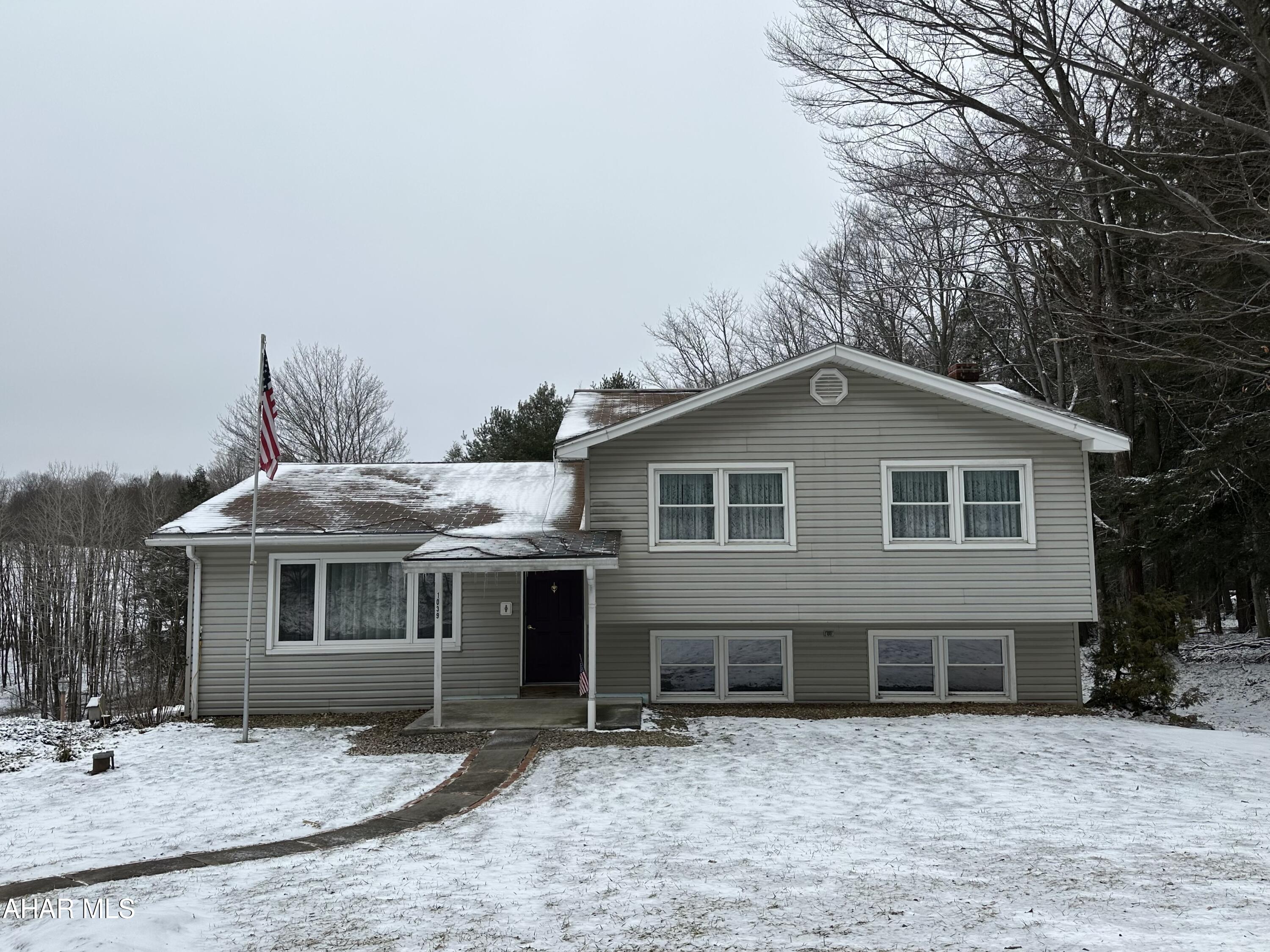 Multi-level home on a beautiful, partially wooded, 2.54 acre lot with Diamond Run passing through the lower part of the lot, 3 bedrooms, 2.5 baths, finished basement with wood burner that walks out at ground level, attached two car garage, lots of paved parking area, shed, newer heat pump with central air