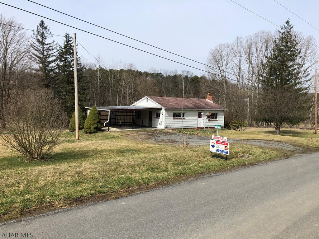 One can only imagine the potential of this quaint 2 bedroom home located on 1.3 +/- acres.  The home's many windows provide plenty of natural light while the full size walk out basement has a workshop and shower.  An oversized 2 car carport can be used for outdoor seating or entertaining.  Simply a wonderful starter home at a terrific price.  Won't last long!