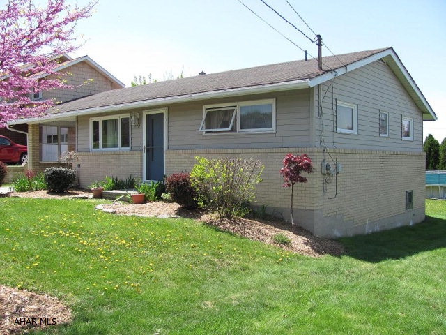 Portage -2 BR brick & frame ranch home with gas hot water baseboard heat, hardwood floors. Gas fireplace in FR. Carport. Move-in condition