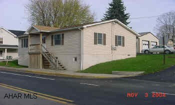 Well cared for "stick built" ranch on large slopping lot. Great starter home at a good price. Laundry room off of the kitchen. No electric in garage. All appliances , tools, work bench, & lawn mower included in a full price offer.  Room for storage in basement.