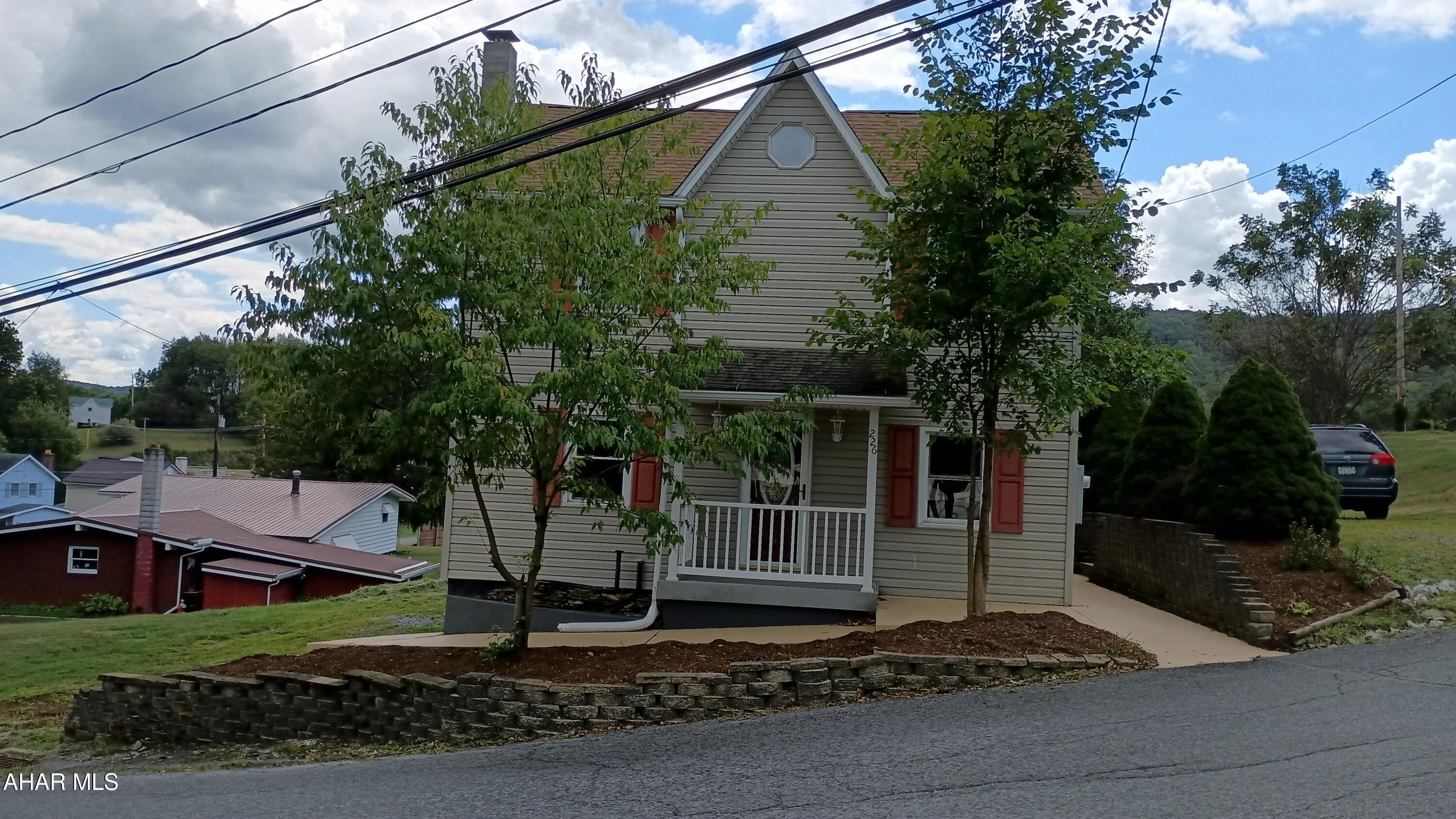 Great Remodeled Home on a Nice Sized Lot within walking distance of the School. 3 BR 2 Bath Home with Lots of Off Street Parking. Freshly Painted Throughout, a lot of New Flooring, and Beautiful Kitchen with All New Appliances! Home is Designed for One Story Living with Master BR with Master Bath, a separate Laundry Room, and Living Room with Cool Fireplace on the First Floor. Second Floor has 2 Bedrooms, Full Bath, and Extra Room with a short ceiling for Children or Storage. Great Outdoor Living with the Huge Vinyl Deck, Fire Pit Area, and Hot Tub. A Tiny House is on the Back of the Lot that would make a Great Play House or Man/Woman Cave.