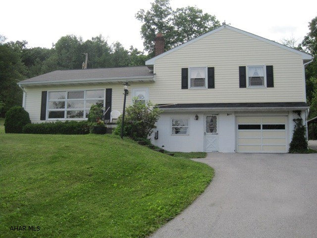 Logan Township; One of a kind; This is original owner of multi-level on 2.7 acres.  The sale includes all appliances, lawn tractor w/48 in. cut and has covered hardwood floors.  The private rear patio overlooks private wooded setting.