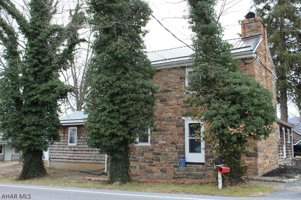 Circa 1784 historic stone home in the beautiful little town of Rainsburg. Three bedrooms, 2 full bath with beautiful hardwood floors, woodburning fireplaces, closed in sunroom with large windows, first floor master suite, grape arbor, and detached garage/garden shed. This home features a new roof, refinished hardwood floors, updated bathrooms, new french doors, ceramic tile floors in bathrooms and way too many updates to mention.