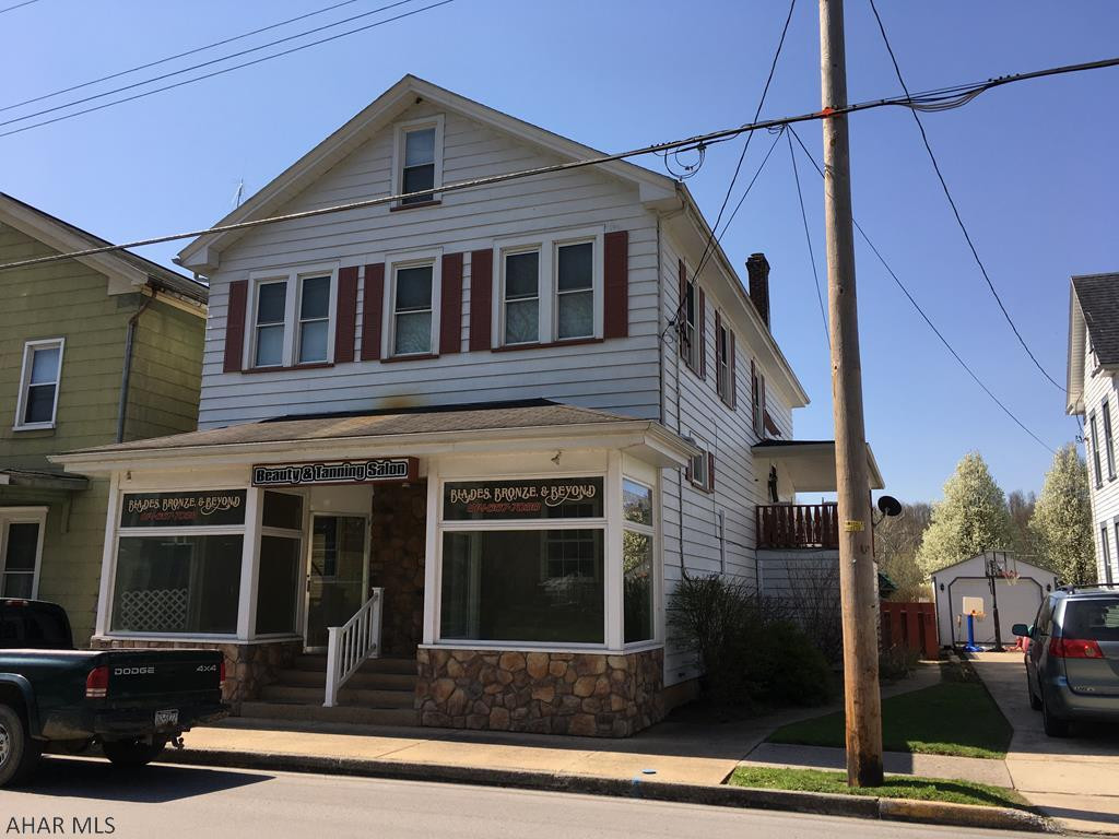 Great opportunity on Main Street in Alexandria. The first floor is a former salon/spa with over 1,900 sf of space. ADA compliant. There are three private rooms, three large open spaces, one of which can be used as a kitchen. The front partition walls are temporary and easily removed to allow for visibility to the street. This could also easily be used as a residential unit. The second floor is a spacious three bedroom apartment. Large double driveway in back plus addition off street parking. Nice level yard with a private patio and a second floor covered porch.
