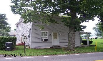 2 story house new roof, new siding, new oak kitchen and new bath.  original logs in living area.  wood burning stove.