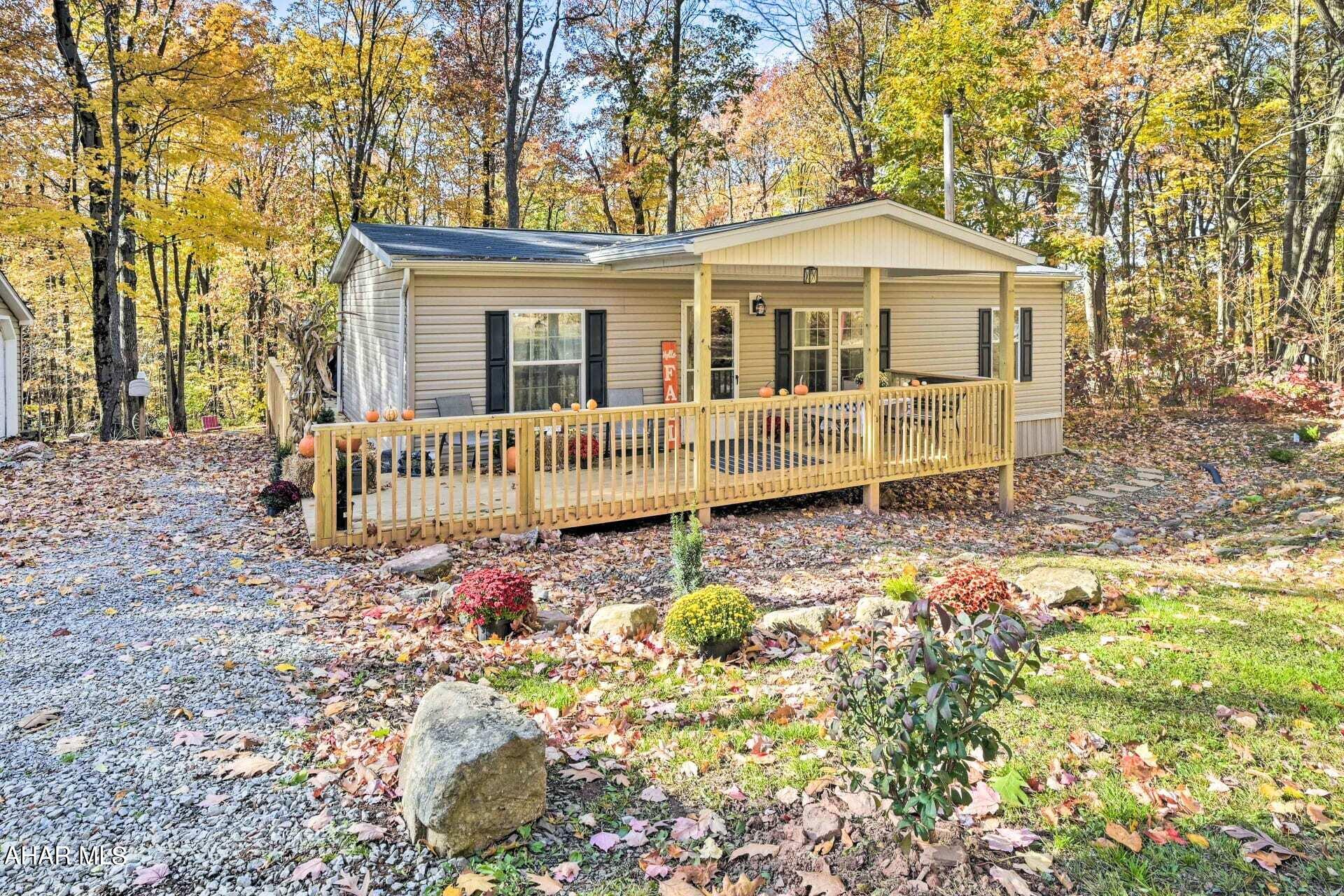 Discover the allure of this absolutely charming 3-bedroom, 2-bathroom rental home, nestled on a sprawling 2.05-acre haven in close proximity to both Blue Knob State Park and Blue Knob Ski Resort. Immerse yourself in the seamless flow of an open-concept kitchen and living room, where the heart of your home effortlessly merges with a modern design. Enjoy the added convenience of a nearby laundry room, enhancing the practicality and functionality of your living space. This fully furnished abode boasts a delightful sunroom, infusing your living space with an extra touch of tranquility. Embrace the convenience of being just a stone's throw away from the renowned King Valley Golf Course, perfect for enthusiasts of the fairway. And now, elevate your cozy nights with the addition of an electric fireplace, ensuring warmth and ambiance as you unwind in the heart of this picturesque setting. Whether you're seeking outdoor adventures or simply a peaceful retreat, this home offers the perfect blend of comfort and proximity to various attractions, ensuring an enchanting stay near the captivating Blue Knob region.