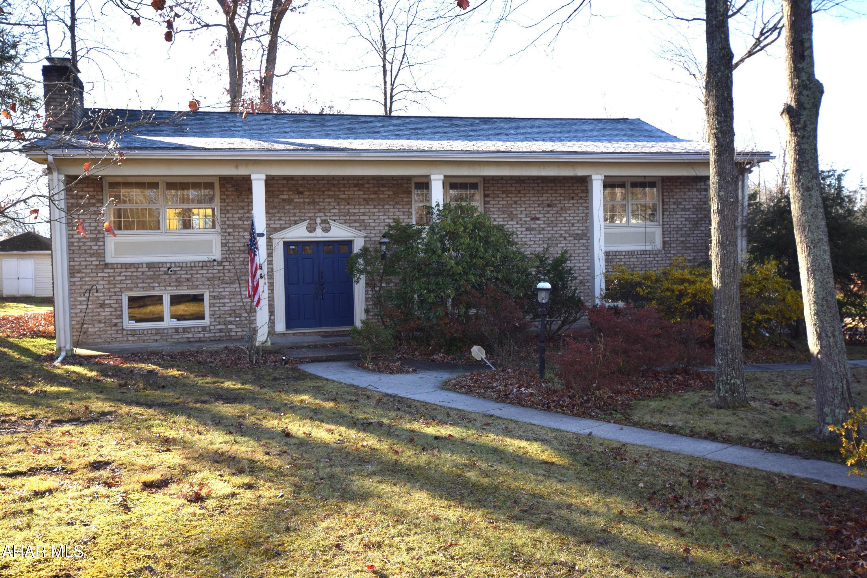 Situated in what could be considered the most desirable location in Hollidaysburg, this bi-level home,  on a nearly half acre corner lot, is ready for a new family.   3 sizable bedrooms, 3 full baths, large living room/dining room with hardwood floors.   Sunroom opens to beautiful composite deck.   Modern kitchen with white shaker cabinets.  Lower level family room with fireplace.   Gas forced air heat with central air.  Fenced area in yard for child and pet safety.  Two car integral garage.