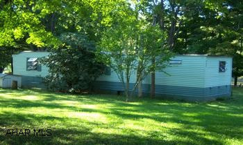 single wide trailer on 4 lots.  two of which are on the opposite side of the road. very well kept trailer on four lots.  bordering the Juniata River.  nice lots