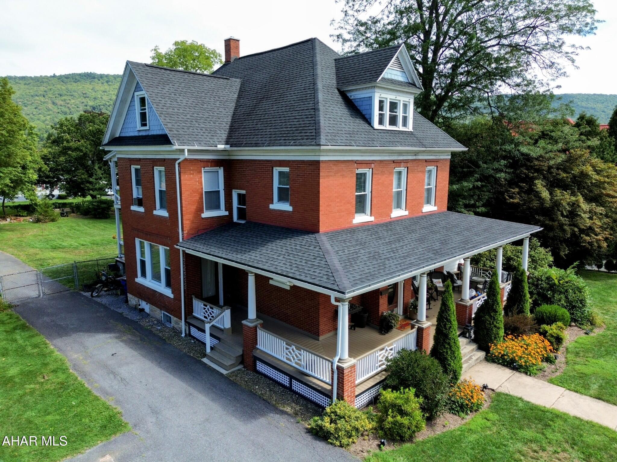 Historic charm meets modern luxury in this downtown Bedford gem!

Discover the perfect blend of timeless character and contemporary style in this beautifully remodeled 4-bedroom, 3-bath brick home in the heart of historic Bedford, PA. Much thought and detail went into the updates within this spacious and historically charming residence.

Step inside to a light-filled interior featuring a beautiful foyer with original wood details including preservation of a charming circular window and refinished hardwood floors.

Continue on to the spacious formal dining room, warm living space with fireplace, and an additional versatile room with custom bookcases. Currently used as a playroom but could easily be a first floor bedroom, office or library. 

Find your way to the custom-designed kitchen with quartz countertops, premium cabinetry, and modern finishes. Some of which include an on demand hot water faucet, wine refrigerator, induction stove and pot filler. This 20ft long kitchen with island provides ample space for entertaining and everyday living. 

The first-floor laundry and full bath adds convenience, while the private yard provides a serene retreat just steps from downtown's shops, dining, and community events. Also find a two car garage and covered porch/decks on front and rear. 

Second floor features another full bath, three bedrooms, which includes the warm and comfortable primary suite, with your dream 13x13 walk-in closet and island! There is a 12x11 bonus space on this floor that could be a small office or reading nook.

Third floor is finished and includes flexible living spaces to ensure there's room for everyone's needs! Check out the playroom, office/bonus space, bedroom, full bath and craft room on this floor.

With generous storage, and elegant updates throughout, this property is as functional as it is stunning.

If you've been searching for a move-in ready historic home that offers both character and modern comfort, this Bedford gem is the one.