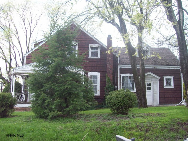 Charming cedar shake shingle home needing a lot of TLC.  Large rooms & newer mechanics.  Rehab loans are available to qualified buyers.  Currently parking off alley for 2 cars.  Plenty of room for garage additions.  Roof installed 9/1995