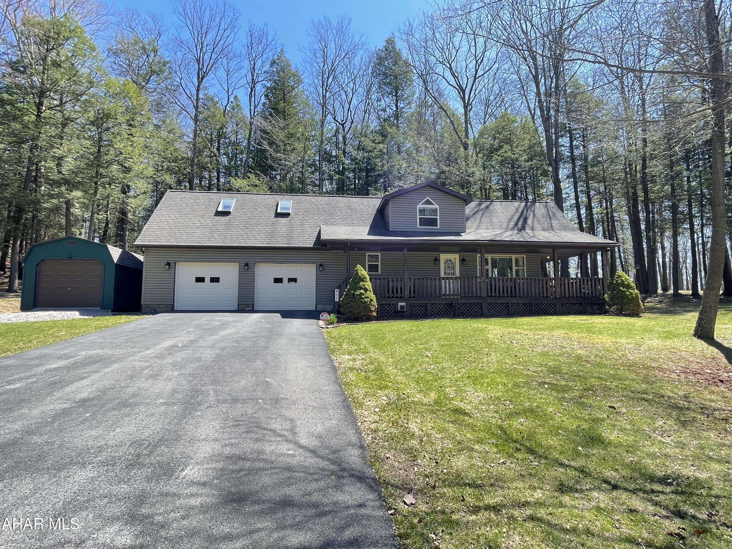This spectacular home is straight out of a magazine with beautiful updates and custom built Amish furniture from Lancaster PA inside and out making this home scream summer getaway! Just a few minute drive to Glendale Lake is this home which has been perfectly set up for your family and friends to spend time together as it currently sleeps 12 people.  Enjoy all that the surrounding area has to offer such as hiking/biking trails, community pool, boating, fishing, kayaking, parks, pavilions and courts.  There is absolutely nothing to do but bring your over night bags as this meticulously maintained property is completely ready for relaxing!  All new luxury vinyl floors on first floor, updated baths with new faucets, kitchen cabinets were refinished and all new hardware installed throughout the home, new granite counter tops, all new lighting installed both inside and outside, along with security cameras to monitor the home while you are away.  The sellers recently installed a NEST thermostat that you can control from your phone while you are away.  New microwave installed, new appliances that are included as well. Basement has a family space bedroom that can sleep 4 and 3/4 bath.  The garage is 27'6''x33'6'' and can fit your vehicle and large toys, there is an additional 1 car garage/shed that can house all your items needed to enjoy the outdoors. Call today and be ready for SUMMER FUN!