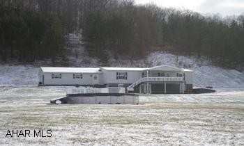 Doublewide with full basement. Basement has large finished game room and office. Beautiful view and country setting. 5 Acres of land.  Storage shed with dog kennels. Moshannon Valley School District
