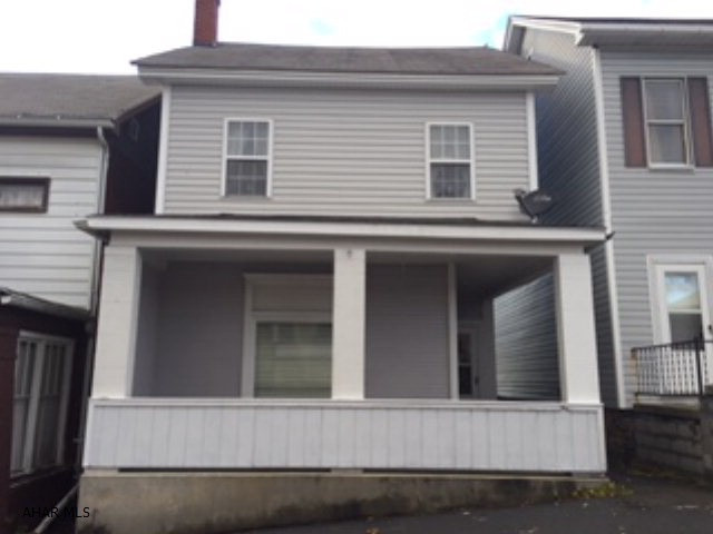 Remodeled kitchen and bath.  Enclosed back porch and covered front porch.  Could have double living room or use one as office/den.  Offstreet parking in rear.  Patio.