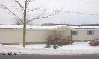 MOBILE HOME ON IT'S OWN FOUNDATION AND GROUND.  3/4 ACRE.  NEWER DRYWALL, INSIDE VINYL SIDED, 3 BEDROOMS, 1.5 BATHS, COVERED FRONT PORCH, COVERED REAR DECK. NICE SINGLE WIDE MOBILE HOME ON 3/4 ACRE WITH PART-FULL BASEMENT, PART CRAWL.  NEWER DRYWALL INSIDE, NICE AMENITIES.  MOTIVATED SELLER.  MUST FIND SUITABLE HOUSING.