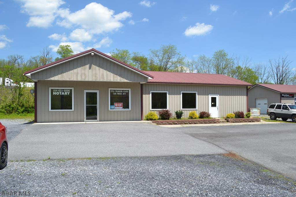 Retail storefront with 350+ feet of road frontage along US route 30 just outside of  Bedford PA.  1100 sq ft. of office space and 840 sq ft of garage space, includes a large heated 4 car garage, 2 back offices and one large front office/ retail area. Natural gas heat & central air conditioning. All desks, chairs, printer, air compressor, file cabinets, etc can be used by the renter. Sewage and water are included in rent. $1575.00 per month.