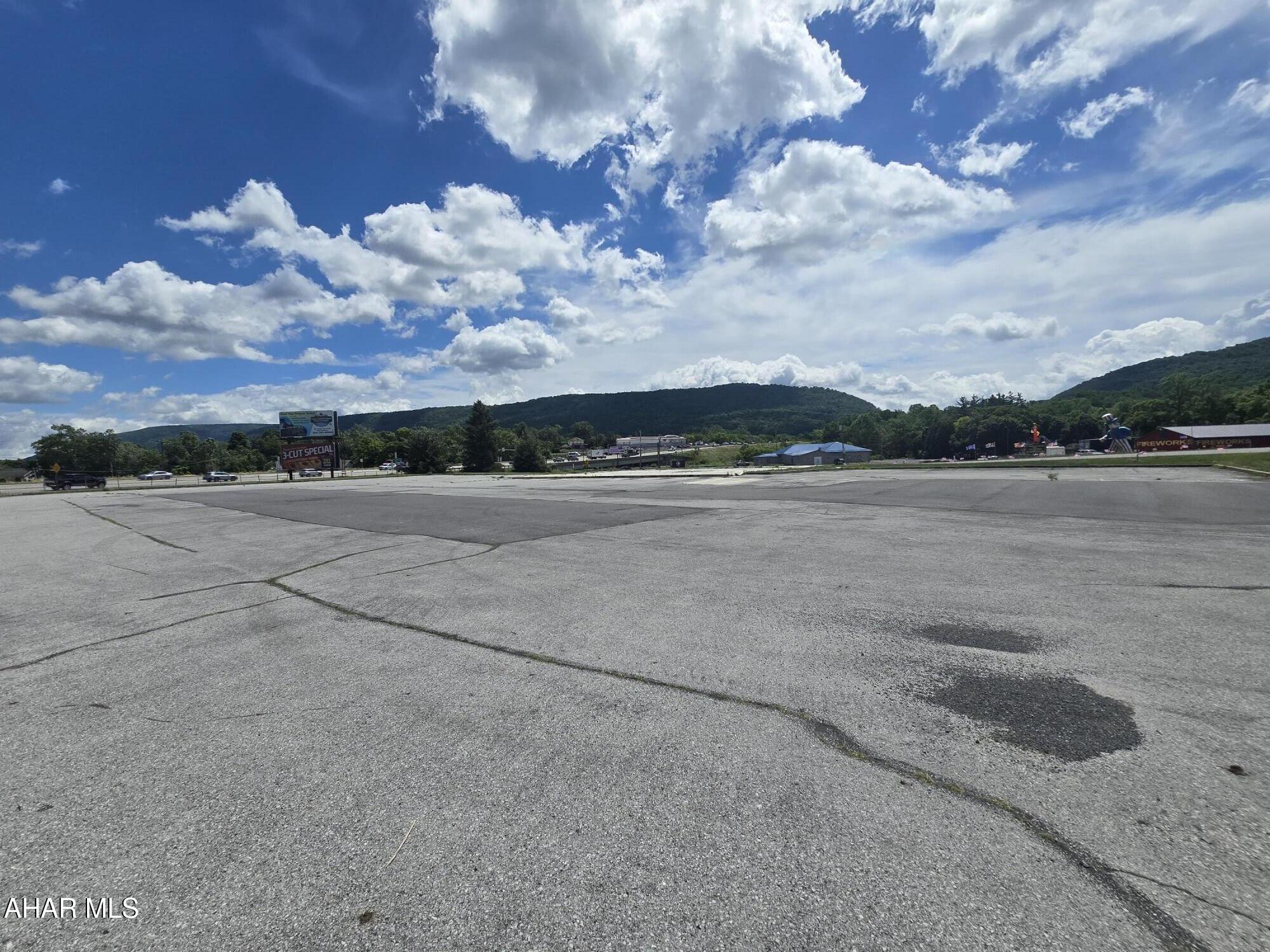 LOCATION!  This corner COMMERCIAL parcel of 1.42 acres is situated between Old Route 220 and Woodbury Pike.  With easy access to and from I99 it is no wonder why there is endless potential.  Currently a blank slate with high traffic count and visibility.  Whether you have an established business you are looking to move or bring a new idea to light- this location is one that is hard to compete with.  Vacant lot is zoned Commercial.