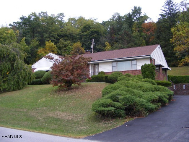 Well built Brick Home. Hardwoods throughout, Art Deco style kitchen with metal cabinets and stainless steel countertops. Huge Living Room with large picture windows. Walk in 10x6 cedar closet for additional storage, large laundry room and storage on lower level - Needs some updating. Terrific private double lot.