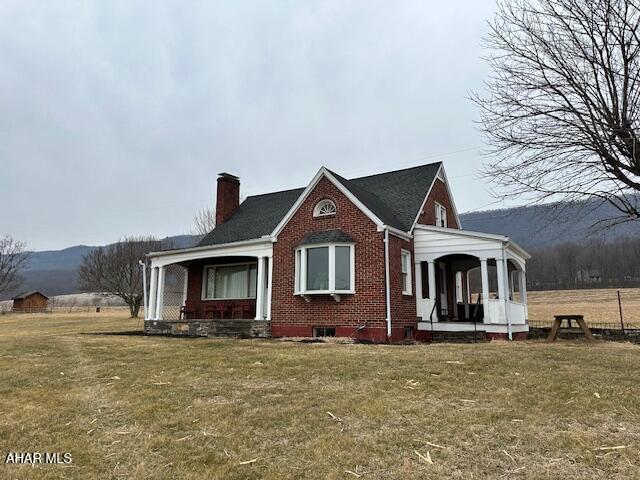 Beautifully maintained brick Cape Cod home just two miles from the Shy Beaver boat launch at Raystown Lake! This charming property features stunning hardwood floors throughout, offering warmth and character in every room. With 3 spacious bedrooms and 2 full bathrooms, it's perfectly suited as a comfortable family home or the ideal vacation retreat for those seeking peaceful living just minutes from the lake. Enjoy breathtaking sunsets from the inviting side porch, or gather with loved ones in the cozy eat-in kitchen designed for everyday comfort and connection. Custom built with care and quality craftsmanship, this home offers timeless style, durability, and a location that combines quiet surroundings with easy access to outdoor adventure.