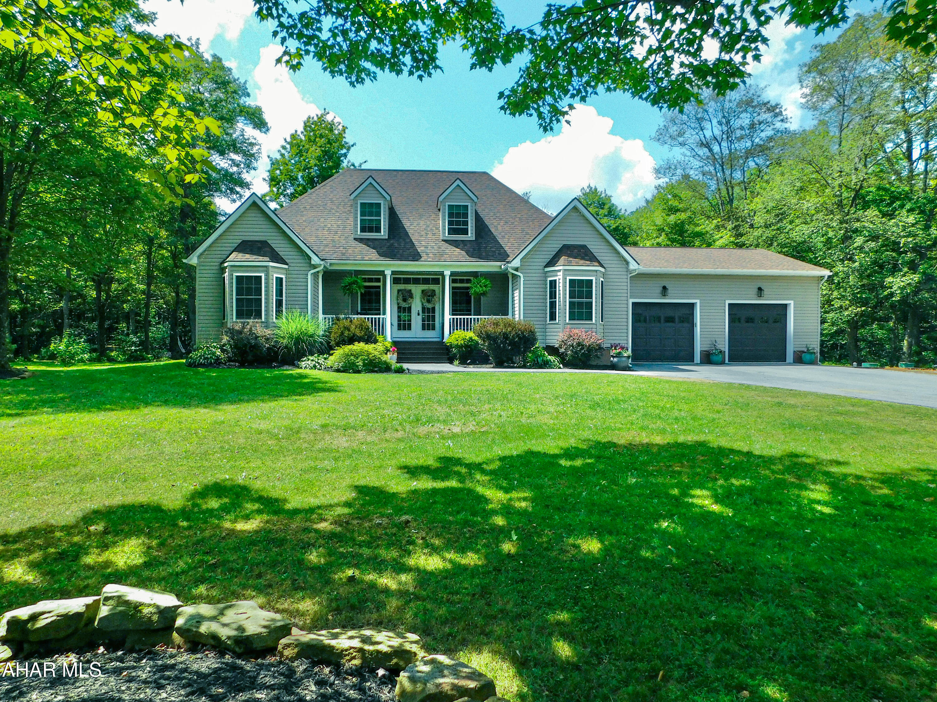 Welcome to the charm that is 1933 Coupon-Gallitzin Road. A True Entertainer's Dream!
This flawlessly designed 4 bedroom, 3 bathroom home is nestled on a serene 2 acre lot. Offering the perfect blend of luxury and functionality, this property is made for those who love both comfort and entertaining.
Step inside to find a jaw-dropping kitchen featuring 2 fantastic pantries, modern cabinetry, and an expansive island, ideal for gatherings or gourmet cooking. The open-concept living and dining areas flow seamlessly, filled with endless natural light and stylish finishes throughout.
The spacious primary suite offers a private retreat with a spa-like ensuite bathroom and incredible walk in closet. The additional bedrooms provide plenty of space even featuring a second primary suite option located on the main floor! 
Outside, the incredible outdoor entertaining area steals the show. Whether you're hosting summer BBQs, evening cocktails, or enjoying quiet mornings surrounded by nature. A large private deck, lush landscaping, and ample space for a pool or garden make the possibilities endless.
Additional features include an oversized 2 car garage, amble parking along the newly paved driveway, generous storage, an outdoor furnace, and, of course, the peace and privacy only a 2 acre property can provide.
Don't miss your chance to own this exceptional home that truly has it all!