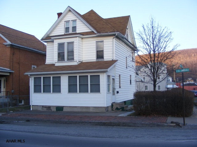 Enclosed front & back porches. Off street parking. Corner lot. New hot water tank. New furnace.