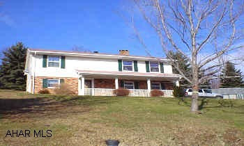 4 bedroom brick & aluminum sided home with new ABV ground pool and sunroom with hot tub. Great views!