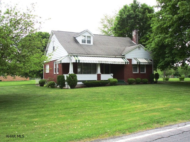 Nice street appeal! Spacious, well built brick, 3 BR, 2-bath, cape cod w/ 1st floor master bedroom, full bath & laundry room + 2-car, 2-story detached garage w/interior stairwell access; circular paved drive; &, level, corner lot. Burnham, oil-fired, hot water boiler new in 2005; circulator pump new in 2013+-. 2 Oil tanks in basement. Cold cellar under ft. porch. Water heater new in 2014. Shingle roof new in 1999. Some replacement windows. Electric baseboard heat in laundry rm. & 1st floor bath.  Propane gas wall unit in family rm.(does NOT work)-Suburban Gas Co. owns tank.  Sq.Ft. is approximate/NOT guaranteed. Per Rick Whetstone Surveyor, April 1, 2015, site is 0.62 acre.