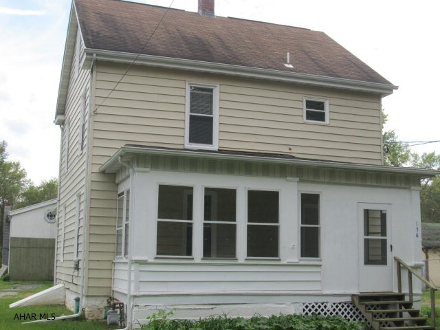 Very nice home that has been updated with newer kitchen, bath with nice size rooms.  You also have a first floor laundry, closed in porches for bonus rooms, breadfast bar.   It even has a second house that you could rent out or move in a family member.  Now this home is in need of repairs.  You could possibly even turn this second home into a garage, storage building.  This all sets on a nice country setting off of Loop Rd.  It is a great bargain at this price~!  Have your Agent look at the Agent Only Comments about certain financing arrangements.