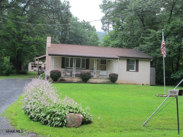 Logan Township/Greenwood. Cute one story in private location. Some appliances are included. Large detached two car garage. Needs some TLC>
