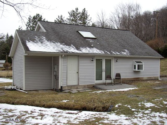 Contemporary loft house next to Altoona Penn St. campus.  This unique house offers private office space, large open floor plan and large loft area.  The sale includes all appliances.  The oversized lot is usable for recreation or expansion.  In summertime sit on your rear patio and listen to the tranquility of your own stream.  This home is priced to sell.