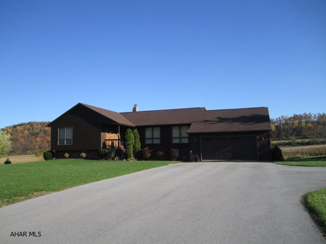 Great family home on a beautiful lot.  Views all around.  Golf across the street & Canoe Creek close by.  3 Nice size BR/2.5 BA, a laundry room, pretty kitchen and large fin. bsmnt.  Frankstown Twp, HAS District.
