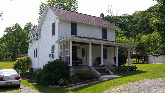 RARE FIND AND ONE OF A KIND. Very well maintained country home on approx. 15 beautiful acres. This home has a private setting but convenient to town. Many new updates including new flooring and roof. Home is 2 bedroom (could easily be converted back to 3)  one bath and a large country kitchen. It sits on a gorgeous open and wooded 15 acres. Enjoy entertaining in the spacious dining room while admiring the views through the oversized windows. Watch wildlife from the peaceful covered front porch. Swim in the 27' above ground pool and relax on its deck. This home has so much character and so many wonderful features that makes it truly one of a kind. It's a MUST SEE!