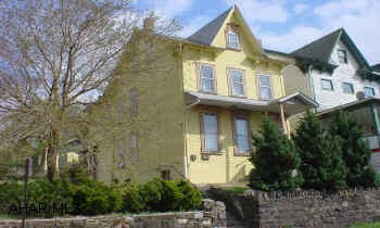 2 1/2 story frame on a double corner lot. Presently duplexed, easily converted to single family. Newer roof and sheating, new bath on 1st floor. Very clean inside, good mechanics, detached garage, needs some TLC on exterior. Worth the look inside. Good starter home or investment property.