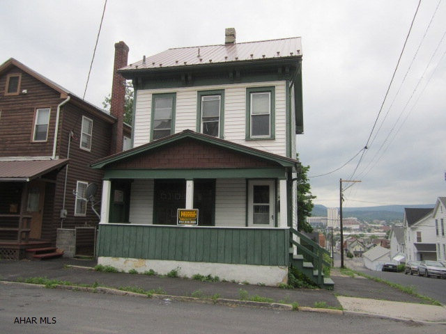 A vinyl sided home with detached garage. Features include new metal roof, most all replacement windows and finished 3rd floor.