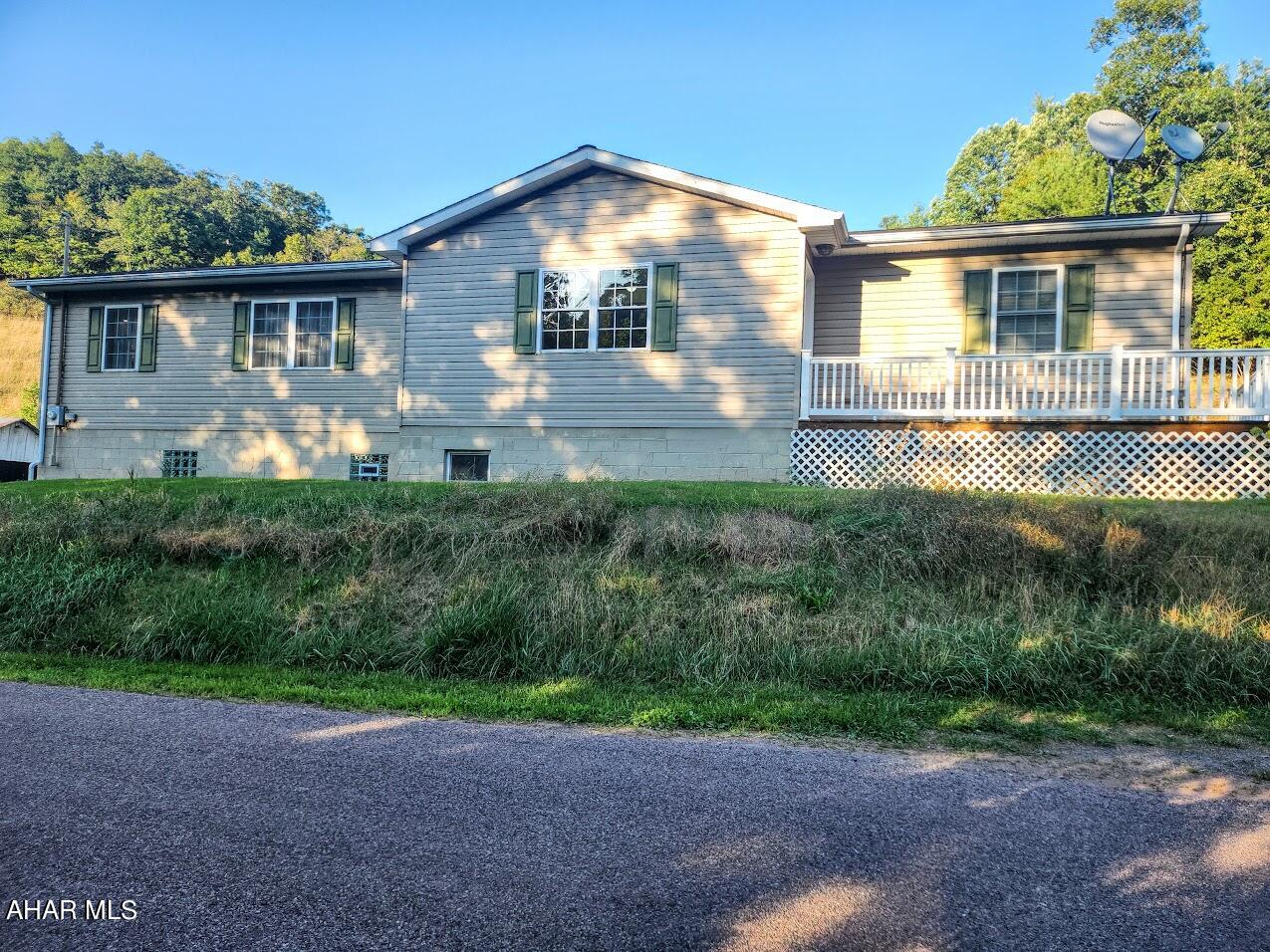 **Charming 2-Bedroom Home on 4.85 Acres with Mountain Views**

Welcome to **1345 Camp Hill Road, Buffalo Mills, PA 15534**—a delightful 1-story frame home situated on 4.85 acres of serene countryside. This move-in-ready home has been thoughtfully upgraded and is perfect for those seeking both comfort and tranquility.

Inside, you'll find 2 cozy bedrooms and 1 bath, along with a spacious open-concept kitchen, living, and dining area—ideal for relaxed living. The main-level laundry room adds convenience to your daily routine. The home has seen many recent updates, including new bedroom carpets in April 2022, a kitchen remodel in April 2023, a new basement toilet and water softener in July 2023, glass block windows in August 2023, vinyl flooring in September 2023, and fresh paint throughout.

Step outside to enjoy the beauty of a small stream that meanders through the property, providing a peaceful ambiance and picturesque mountain views. The property also features several outbuildings, perfect for storage or hobbies. Hunters and nature lovers alike will appreciate the abundant wildlife, including deer and turkeys.

Don't miss out on this hunter's paradise and tranquil retreat—schedule your showing today!