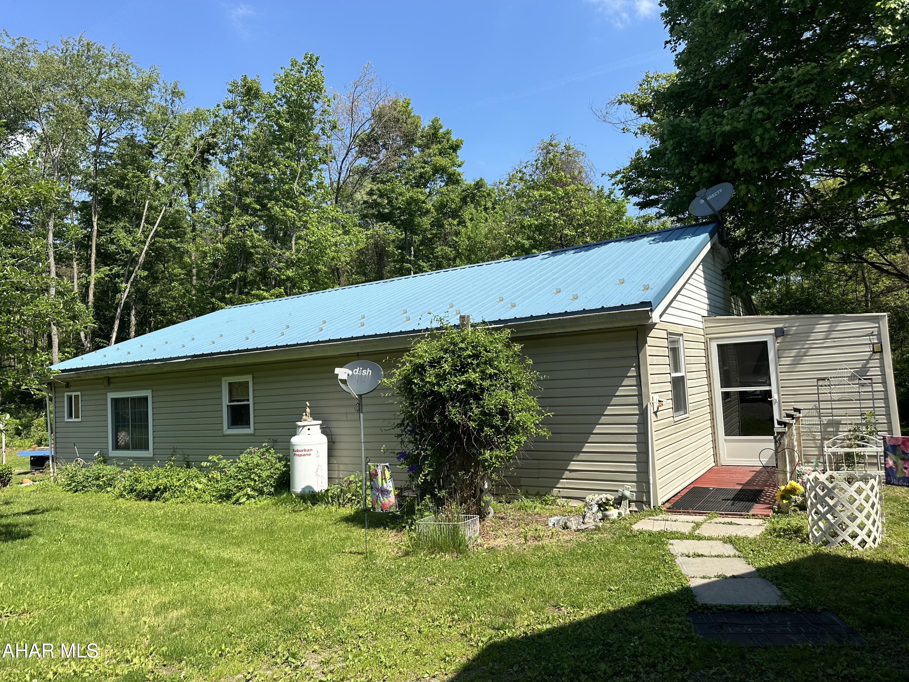 If you want seclusion and off the beaten path, this is the property for you. This home offers 3 bedrooms and 1 bath, 2 car carport, shed, bonus building that owner stores his backhoe and lawn equipment plus one stable that previously had horse in it. Weather this is your primary residence or a retreat, this one is worth a look.