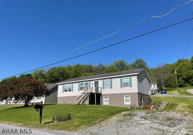 This well maintained and spacious modular home sits on a large corner lot. The large living room is open to the dining room, great for entertaining family and friends, the galley kitchen has new counter tops and back splash, laundry area is open to the kitchen and is connected by a door to the master bath. Large master bedroom with plenty of closet space. On the other side of the home, there is a large full bath, two bedrooms both with new flooring, and a large family room with sliding glass doors to the back. The large unfinished basement has high ceilings, it has been plumbed for a bathroom, and could be finished for additional living space. There are some newer windows and doors throughout. Enjoy the view off of the deck all year long! Call today!