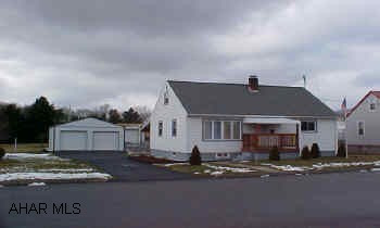From R. Spring Rt. 164, straight at Martinsburg light, go 2 blocks and turn right on mulberry; home on right. J-699 From R. Spring Rt. 164, straight at Martinsburg light, go 2 blocks and turn right on mulberry; home on right. J-699  Nice Cape Cod with vinyl siding and windows. 2002 roof, newer garage.