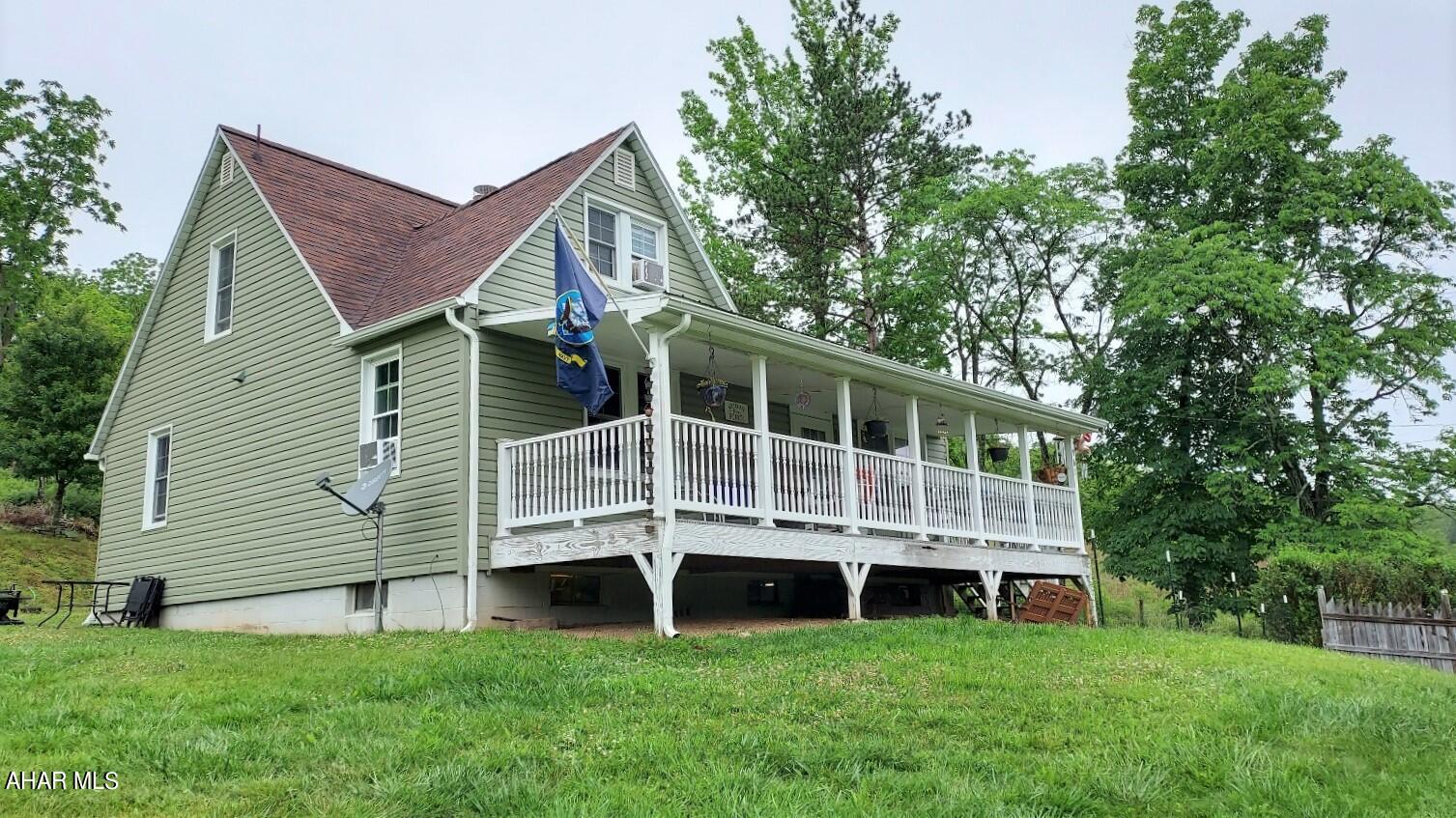 This cozy 5+ acre farmette is located conveniently close to Bedford, PA and the Maryland state line, with state parks, lakes and other attractions nearby. This property provides you with a large garden, fruit trees, wooded acreage for hunting, several outbuildings for equipment storage, with new siding, gutters and downspouts on the house itself.  There is a large front porch with steps leading down into the partially fenced front yard. Inside features a new kitchen with wall oven and cooktop, open living space with new wood burning stove and a handicap accessible full bath, all with new flooring. The 2 bedrooms on the main floor have original hardwood floors. The second story has 2 bedrooms and a landing with new carpeting and the other full bath. You don't want to miss your chance to see this home in person!