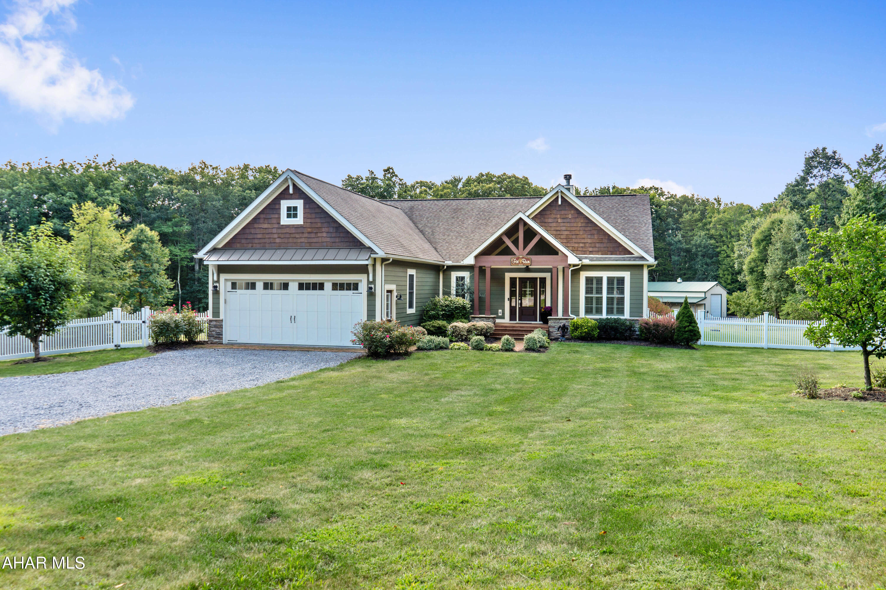 Absolutely stunning custom built home resting on 3.18 scenic acres. The main level offers a large foyer with double door coat closet; great room with a beamed cathedral ceiling and stone fireplace; kitchen with center island, solid surface counters, tile backsplash, and an eat-in area; office/den; laundry/mud room; owner's suite bedroom featuring a walk-in closet, connected bath with c. tile shower, double bowl vanity and soaking tub; two additional bedrooms and another full bath with c. tile floors and c. tile surround. Full basement already set up with a full c. tile bath, windows, and easily finishes off into the perfect rec room, game room, or family room. Insulated windows with custom plantation blinds, recessed lighting, custom floor coverings, arched doorways and large fenced yard are just small sample of this homes amenities. Amazing rear porch with recessed lighting and ceiling fans that is perfect for relaxation, peaceful country view gazing, or hosting a party for all to enjoy. GEOTHERMAL heating and cooling, two-car attached garage, a 24' x 48' four-car (or RV) detached garage, and a storage shed. The detached garage has a 14' overhead door and also has a large c. tile bathroom inside. Situated just minutes away from Shawnee State Park, easy access to State Route's 30 & 96 and less than 2 hours east of Pittsburgh. The quality is in the details of this remarkable property!!
