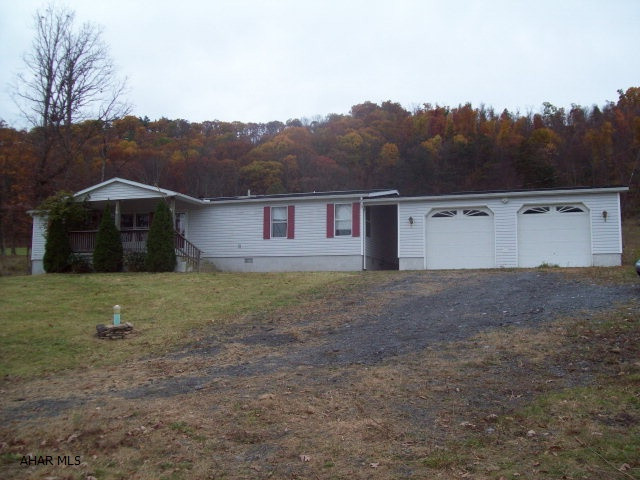 3 bedroom, 2 bath dblwide on full foundation with small breezeway and oversized 2car garage on 1 acre.  Private setting.